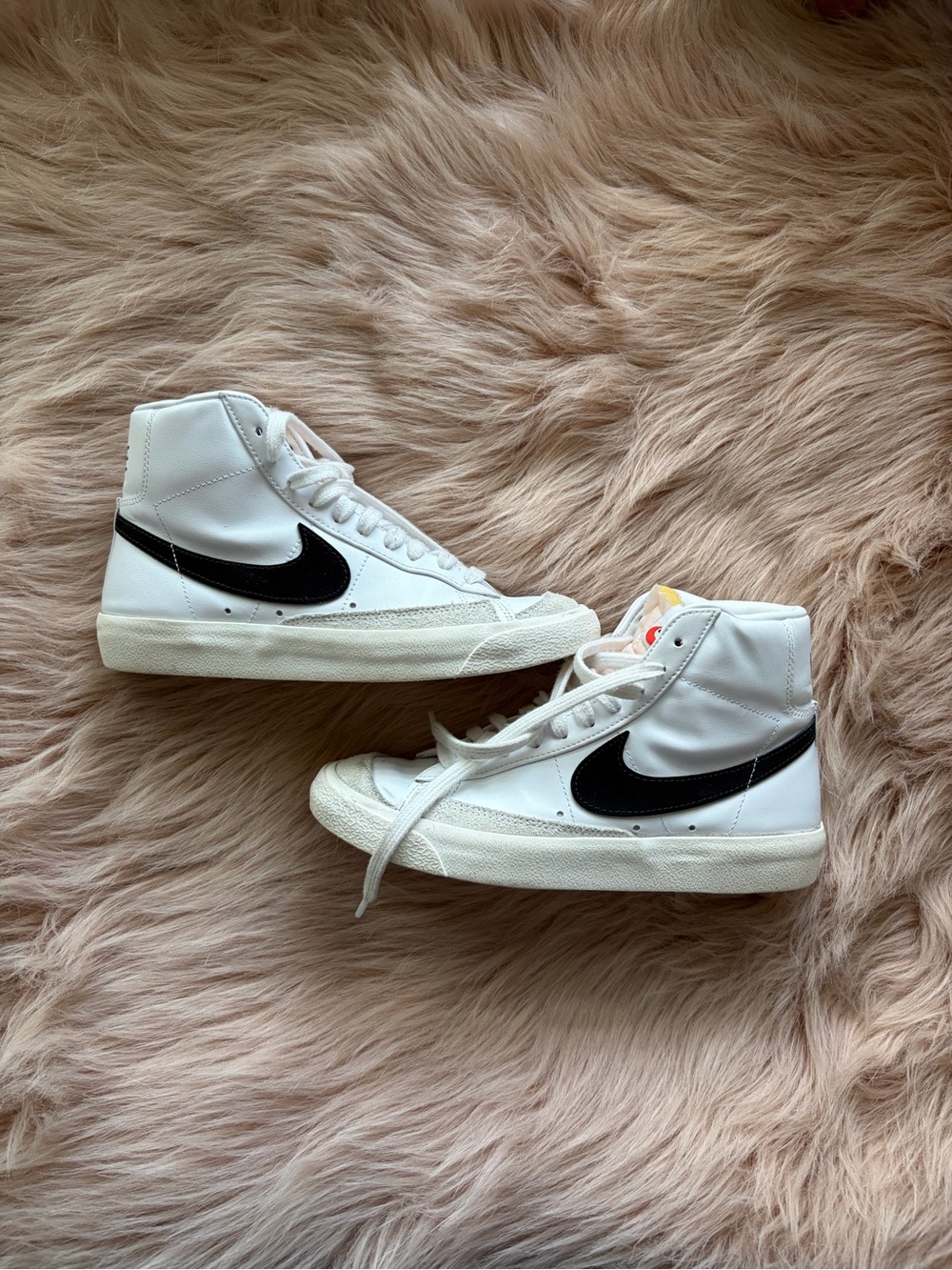 Nike White High-Top Sneakers with Black Swoosh